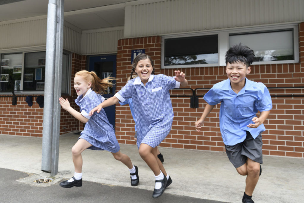 school boy falls into drain in the schoolyard